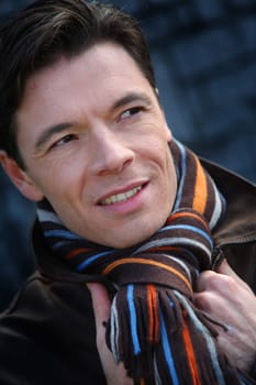 Portrait of handsome man wearing scarf