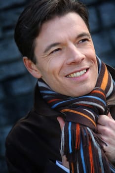 Portrait of handsome man wearing scarf
