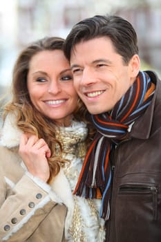 Happy couple doing shopping in town