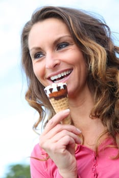 Portrait of woman eating ice cream cone