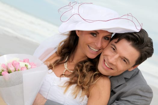 Portrait of happy married couple at the beach