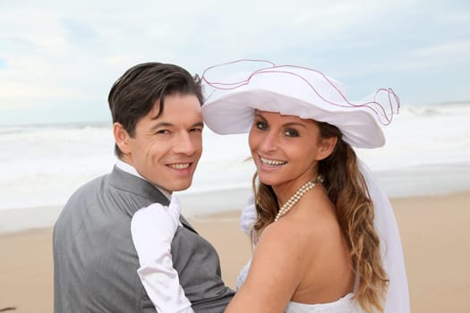 Portrait of happy married couple at the beach