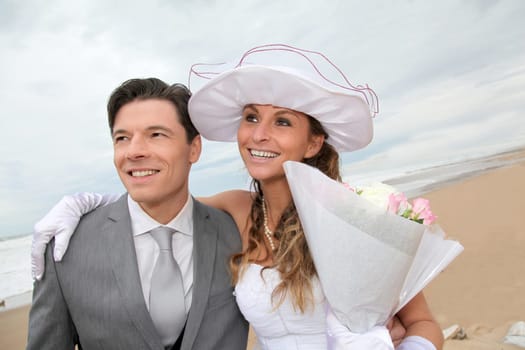 Portrait of happy married couple at the beach