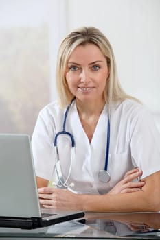 Beautiful blond nurse at work