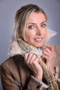 Portrait of blond woman wearing winter jacket