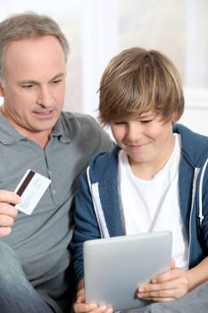 Father and son doing online shopping