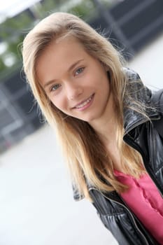 Closeup of teenage girl sitting on a school bench