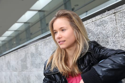 Closeup of teenage girl sitting on a school bench