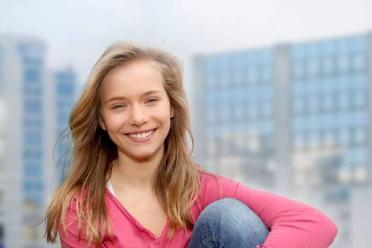 Closeup of teenage girl sitting on a school bench