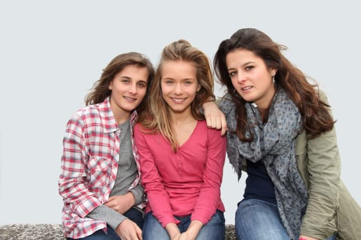 Group of teenagers sitting on school bench