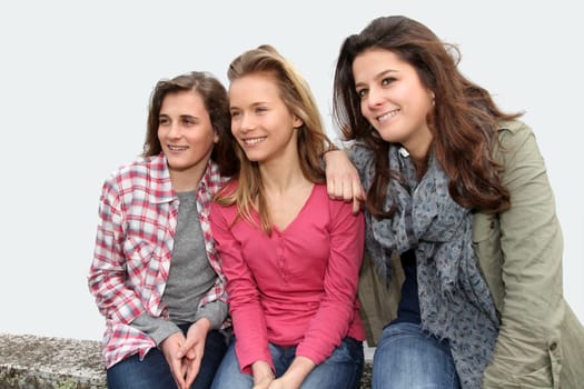 Group of teenagers sitting on school bench