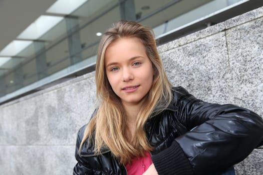 Closeup of teenage girl sitting on a school bench