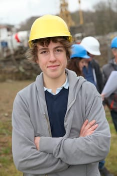 Portrait of teenager with security helmet