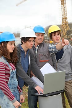 Adult with group of teenagers in professional training