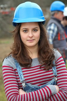 Portrait of teenager with security helmet