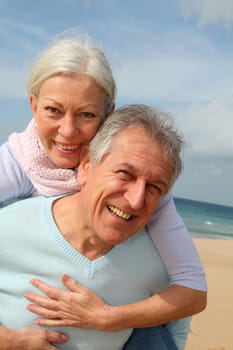Happy senior couple at the beach