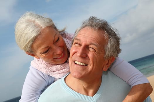 Happy senior couple at the beach