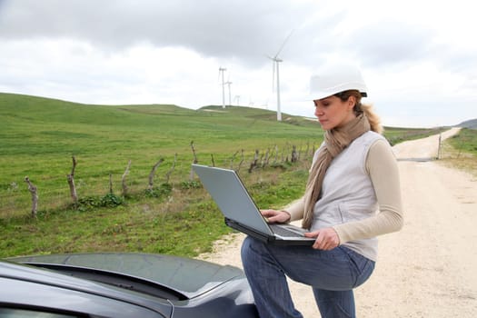 Engineer in wind turbines field using electronic tablet