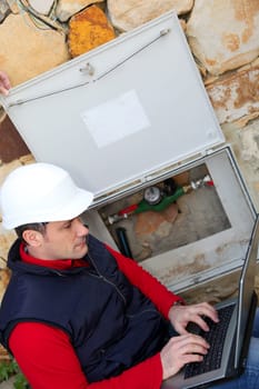 Man reading domestic water consumption