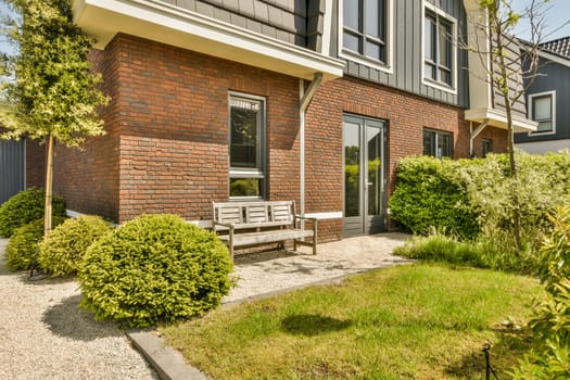 an outside area with some trees and bushes in the foreground, as well as it appears on this sunny day