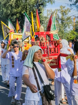 PHUKET, THAILAND - OCTOBER 19: Unidentified participants in street procession ceremony at Hok Ong Tong Shrine, Phuket Vegetarian Festival in Phuket Town, Phuket, Thailand on the 19th October, 2023.