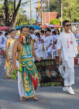 PHUKET, THAILAND - OCTOBER 19: Unidentified participants in street procession ceremony at Hok Ong Tong Shrine, Phuket Vegetarian Festival in Phuket Town, Phuket, Thailand on the 19th October, 2023.