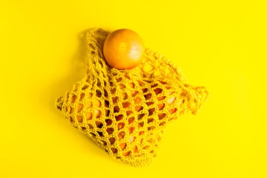 Oranges and tangerines on a yellow background. Fresh healthy food. Chinese New Year