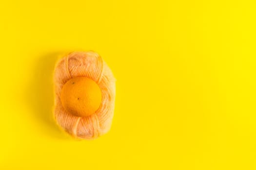 Oranges and tangerines on a yellow background. Fresh healthy food. Chinese New Year