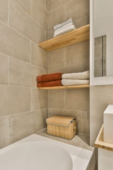 a bathroom with shelves on the wall and a white bathtub in the corner next to the tub is empty