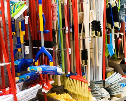 Large assortment of brushes for cleaning premises in store. Trade in floor cleaning equipment