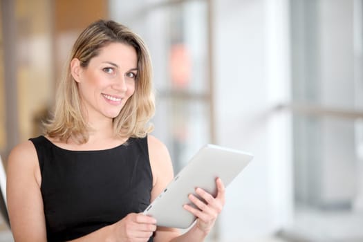Businesswoman using electronic tab