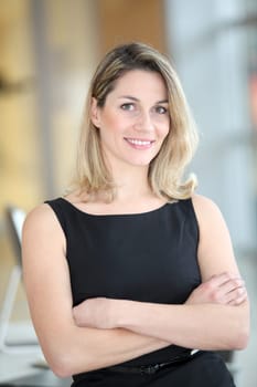 Portrait of beautiful businesswoman with arms crossed