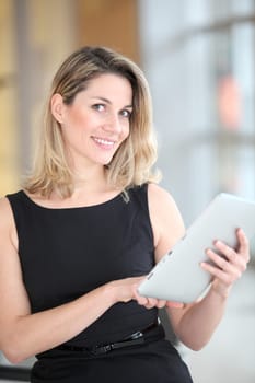 Businesswoman using electronic tab