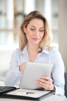 Office worker using electronic tab