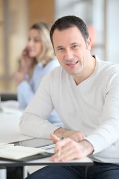 Office worker in the office using electronic tab