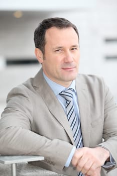 Businessman standing outside the office