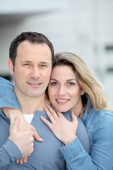 Portrait of happy couple standing outdoors