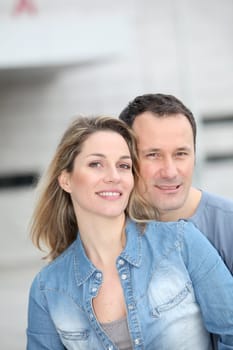 Portrait of happy couple standing outdoors