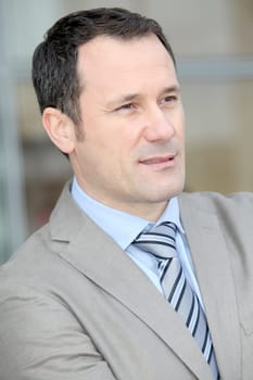 Businessman standing outside the office
