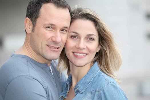 Portrait of happy couple standing outdoors