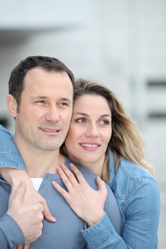 Portrait of happy couple standing outdoors