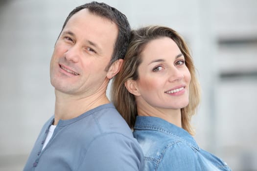 Portrait of happy couple standing outdoors