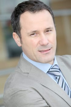 Businessman standing outside the office