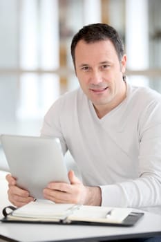Office worker in the office using electronic tab