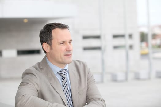 Businessman standing outside the office