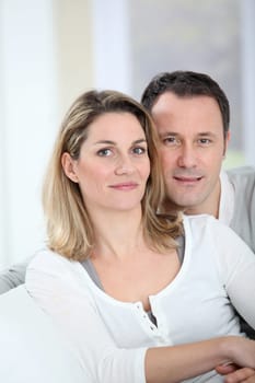 Portrait of happy couple at home