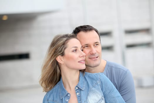 Portrait of happy couple standing outdoors