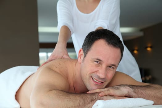 Handsome man having a massage
