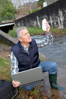 Hydrobiologist testing quality of water