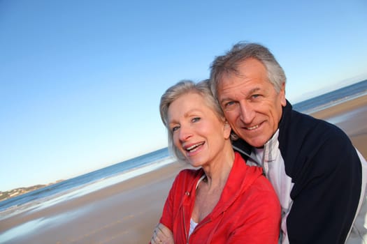 Senior couple exercising by the sea